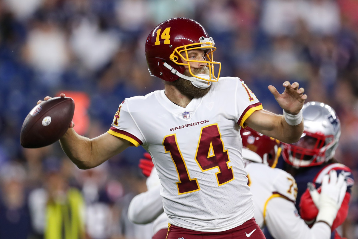 Aug 12, 2021; Foxborough, Massachusetts, USA; Washington Football Team quarterback Ryan Fitzpatrick (14) passes the ball against the New England Patriots during the first half at Gillette Stadium. Mandatory Credit: Paul Rutherford-USA TODAY Sports